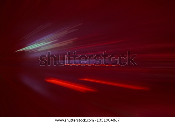 RED SPEED LIGHT LINES ON THE
NIGHT HIGHWAY ROAD, BLURRED MOTION OF CAR ACCELERATIONG IN
TUNNEL