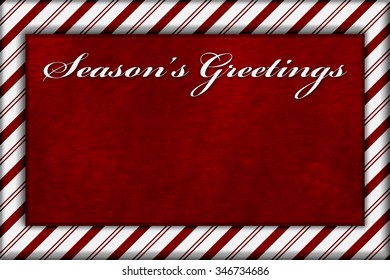 Red and White Striped Candy Cane Striped with embroidery and red plush Background with copy space for your message and text Season's Greetings