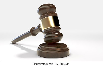 A regular wooden auctioneers hammer or judges gavel with brass trim on an isolated white studio background - 3D render