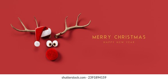 Reindeer with red nose and Santa hat on red background. Christmas greeting card design with text. 3D Rendering, 3D Illustration, Hand made illustration - Powered by Shutterstock