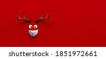 Reindeer toy with cold red nose and medical mask on red Christmas Corona background 3D Rendering, 3D Illustration