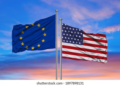 Relationship between the USA and the European Union. Two flags of countries on heaven with sunset. 3D rendered illustration.