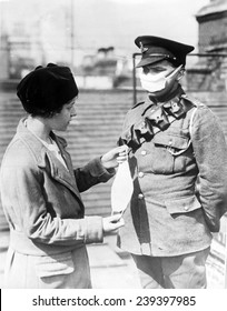 Respirator For British Soldiers- A Nurse Demonstrates A Facemask On A British Soldier During The Influenza Epidemic, Ca.1918