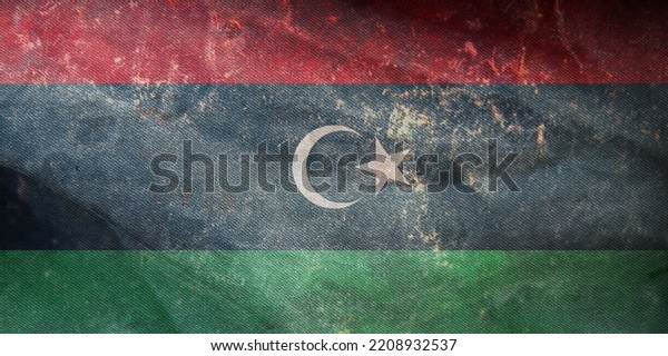 retro flag of Arab peoples Libyans with\
grunge texture. flag representing ethnic group or culture, regional\
authorities. no flagpole. Plane design,\
layout