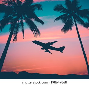 Retro Style Photo Of Plane Over Tropical Scene