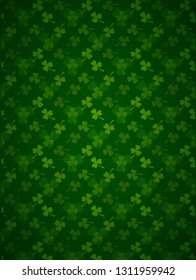Rich green Saint Patrick's Day frame with four-leaf clover shamrock leaves pattern. Irish festival celebration greeting card design background. Vertical backdrop. - Shutterstock ID 1311959942