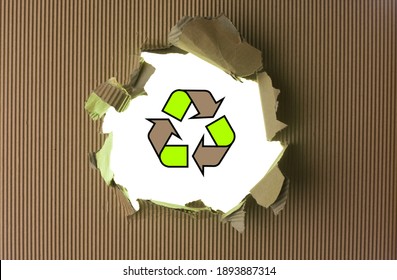 Ripped brown paper with recycle logo against background - Shutterstock ID 1893887314