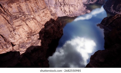 A river flowing through a canyon surrounded by mountains