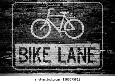 Road Sign Pictogram Bike Lane Graffiti On Brick Wall