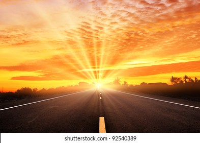 Road and the sunset sky - Powered by Shutterstock