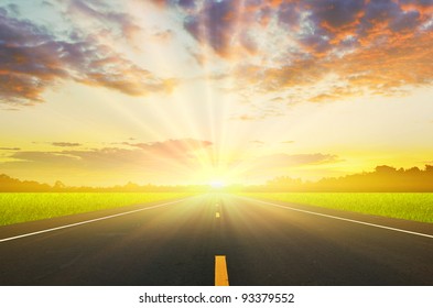 Road and the sunset sky - Powered by Shutterstock