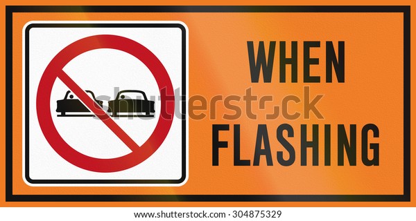 Roadworks sign in Canada - no overtaking when\
flashing. This sign is used in\
Ontario.