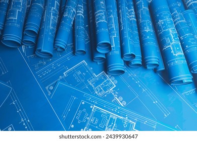 Rolled architectural blueprints showcasing intricate design plans, symbolizing the meticulous planning and creative process in architecture and engineering. - Powered by Shutterstock