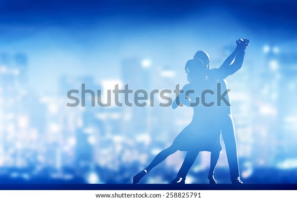 Romantic couple dance. Elegant classic pose.\
City nightlife\
background