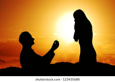 Romantic proposal scene with happy woman and man. - Powered by Shutterstock