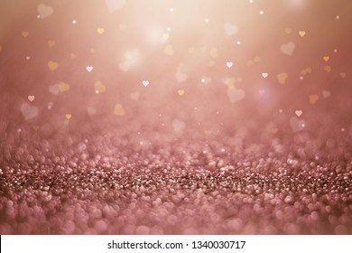 Rose Gold Abstract Background With Glowing Heart Shape Texture. 