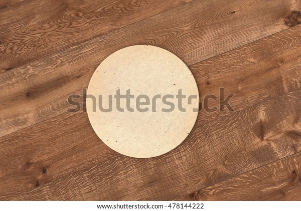 Round retro beer coaster. Isolated on wood\
background. 3d\
render