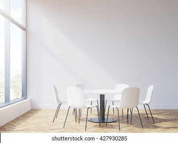 Round Table And Chairs In Conference Room Interior With Wooden Floor, Blank Wall And Window With City View. Mock Up, 3D Rendering