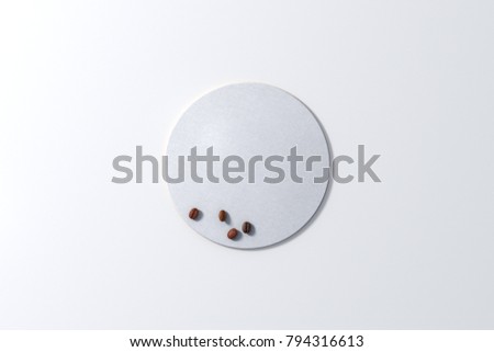 Round white coaster and coffee beans on white background. 3d illustration