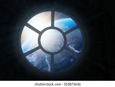 A Round Window On A Space Station With A View Of Earth Below