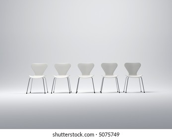 Row Of Five White Plastic And Metal Chairs In A Neutral Background