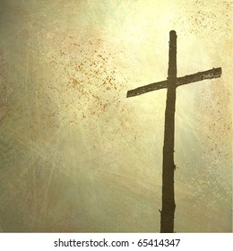 rugged cross on faded yellowed light grunge background with copy space