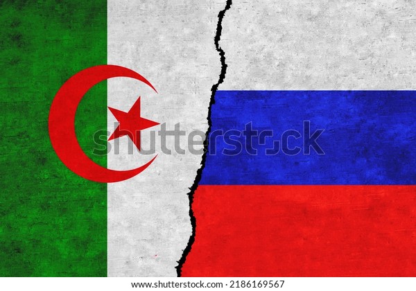 Russia and Algeria painted flags on a wall with\
a crack. Russia and Algeria relations.Algeria and Russia flags\
together