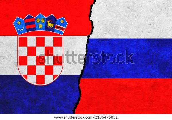 Russia and Croatia painted flags on a wall with\
a crack. Russia and Croatia relations. Croatia and Russia flags\
together