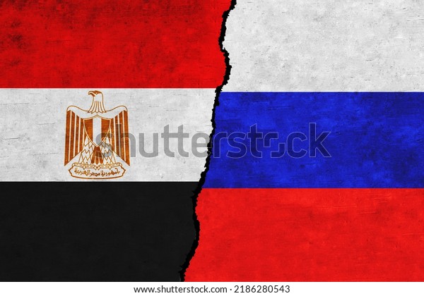 Russia and\
Egypt painted flags on a wall with a crack. Russia and Egypt\
relations. Egypt and Russia flags\
together