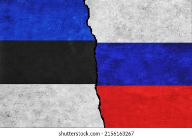 Russia and Estonia painted flags on a wall with a crack. Russia and Estonia conflict. Estonia and Russia flags together
