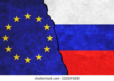 Russia and EU painted flags on a wall with a crack. Russia and European Union conflicts. EU and Russia flags together