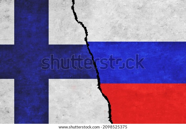 Russia and Finland painted flags on a wall with a\
crack. Russia and Finland relations. Finland and Russia flags\
together. Russia vs\
Finland