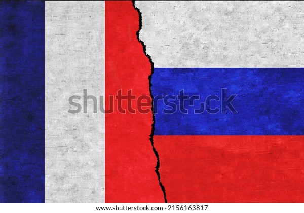 Russia and\
France painted flags on a wall with a crack. Russia and France\
conflict. France and Russia flags\
together