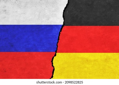Russia and Germany painted flags on a wall with a crack. Russia and Germany relations. Germany and Russia flags together. Russia vs Germany