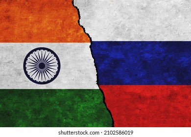 Russia and India painted flags on a wall with a crack. Russia and India relations. India and Russia flags together