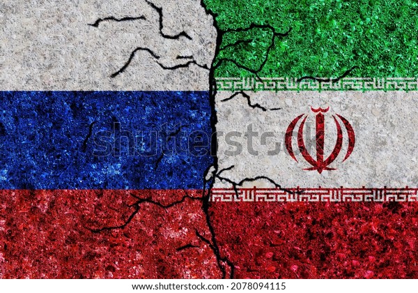 Russia and Iran flags painted on grunge texture\
wall. Russia vs\
Iran