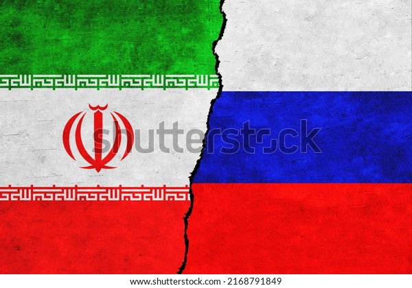 Russia and Iran\
painted flags on a wall with a crack. Russia and Iran relations.\
Iran and Russia flags\
together