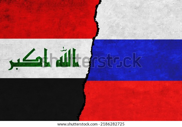 Russia and Iraq\
painted flags on a wall with a crack. Russia and Iraq relations.\
Iraq and Russia flags\
together