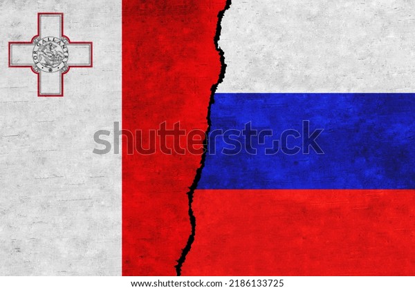 Russia and\
Malta painted flags on a wall with a crack. Russia and Malta\
relations. Malta and Russia flags\
together