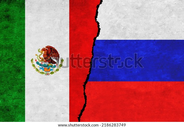 Russia and\
Mexico painted flags on a wall with a crack. Russia and Mexico\
relations. Mexico and Russia flags\
together