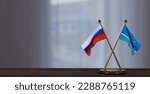 Russia and Midway Islands flags on table. Negotiation between Midway Islands and Russia. on little blur background. 3D work and 3D image