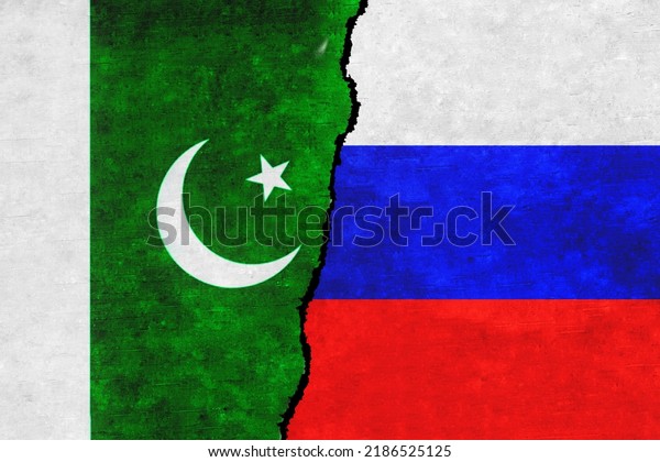 Russia and Pakistan painted flags on a wall with\
a crack. Russia and Pakistan relations. Pakistan and Russia flags\
together
