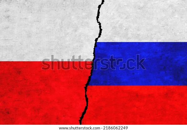 Russia and\
Poland painted flags on a wall with a crack. Russia and Poland\
relations. Poland and Russia flags\
together