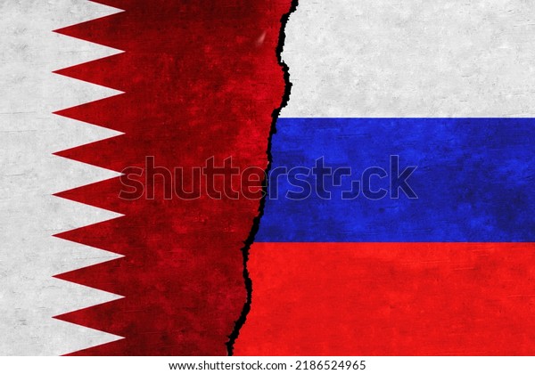 Russia and\
Qatar painted flags on a wall with a crack. Russia and Qatar\
relations. Qatar and Russia flags\
together