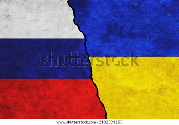 Russia and Ukraine painted flags on a wall with\
a crack. Russia and Ukraine relations. Ukraine and Russia flags\
together