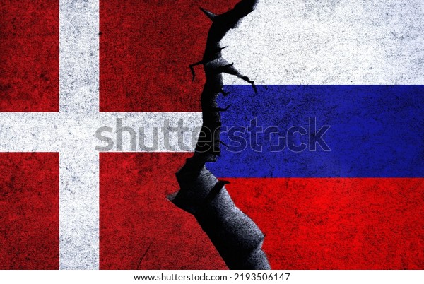 Russia vs Denmark concept flags on a wall with a\
crack. Denmark and Russia political conflict, war crisis, economy\
relationship, trade\
concept