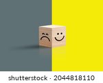 Sad happy concept. smiley face and sad face icon on wood cube, Service rating, satisfaction concept, and Optimism pessimism concepts. 3d Wooden Cub. Bright yellow and dark background. 3D illustration 