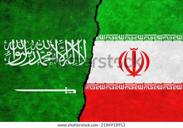 Saudi Arabia and Iran painted flags on a wall\
with a crack. Saudi Arabia and Iran relations. Iran and Saudi\
Arabia flags\
together