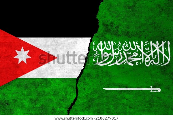 Saudi Arabia and Jordan painted flags on a wall\
with a crack. Jordan and Saudi Arabia relations. Saudi Arabia and\
Jordan flags\
together