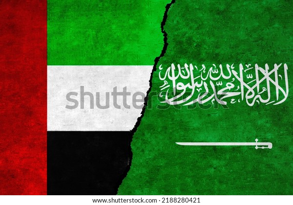 Saudi Arabia and United Arab\
Emirates painted flags on a wall with a crack. UAE and Saudi Arabia\
relations. Saudi Arabia and United Arab Emirates flags\
together